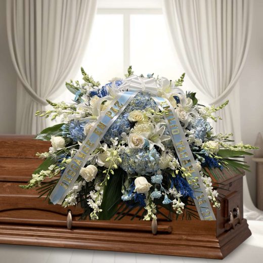 Light blue and white half casket spray