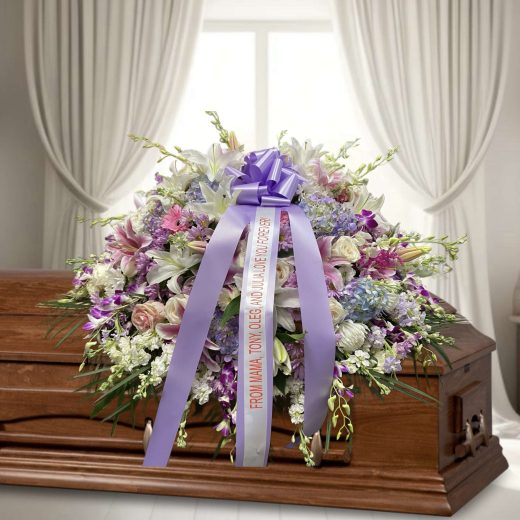 Pink, lavender and white half casket spray